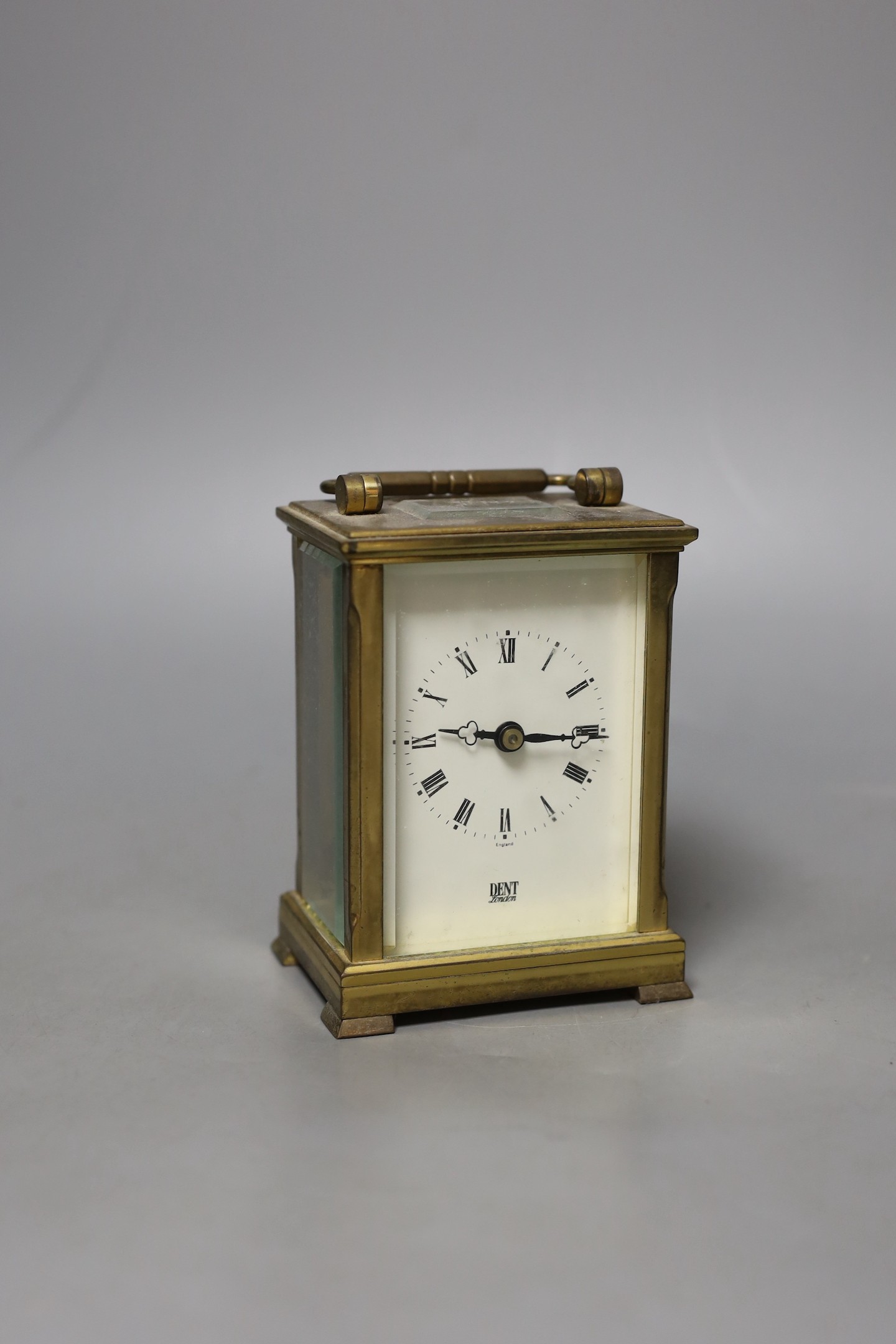 A Dent retailed brass carriage timepiece, 12 cms high.